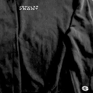 Champion-made cotton black hopeless sweater with the Popular Front logo.